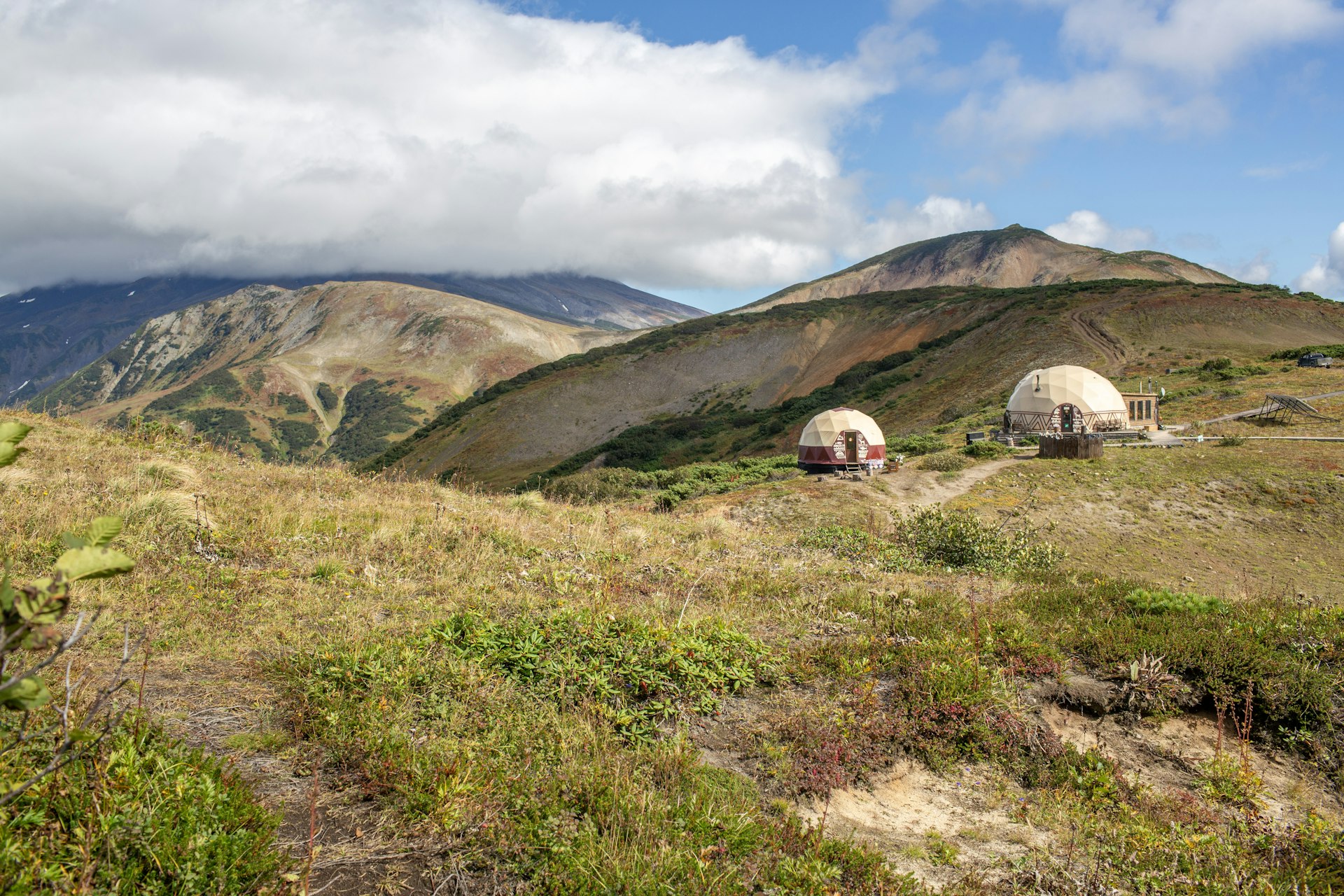 Geodesic dome in a natural landscape
